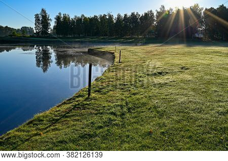 Watertrap On Golfcourse Early Morning In Sweden