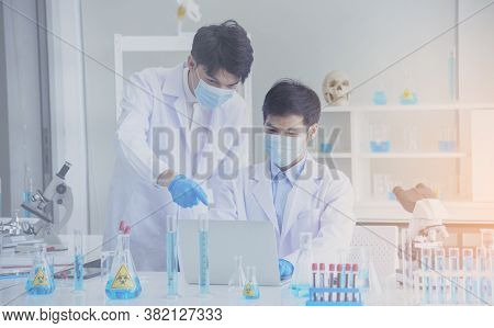 Two Asian Scientist Team Reserch Chemistry Science Tube Experiment Biotech Antibody Sample In Labora