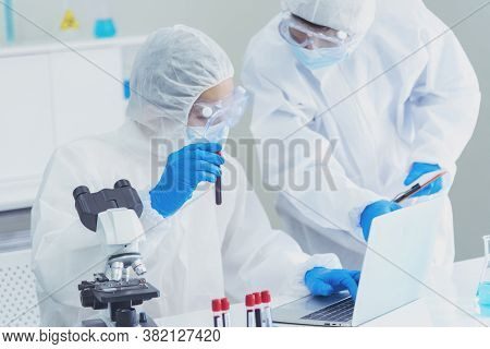 Two Asian Scientist Team Reserch Chemistry Science Tube Experiment Biotech Antibody Sample In Labora