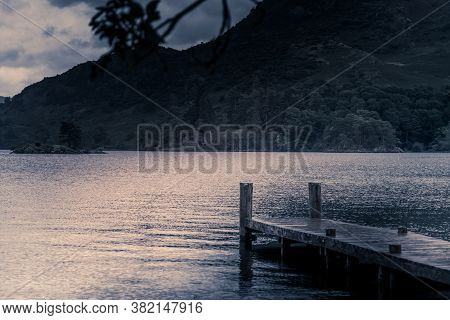 View Of Stormy Skies And Jetty North East Across Ullswater From Glenridding