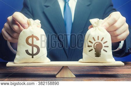 Dollar Money Bag And Ideas Patents. Buying A Startup. Invest In Promising Companies, Technologies. S