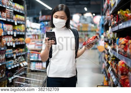 Asian Woman Wearing Hygiene Mask Prevention Virus And Pollution ,shopping Buying Foods At Supermarke