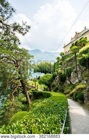 Villa Balbianello. Lake Como. Italy - July 19, 2019: Footpath Following to Famous Tree in Garden at Villa del Balbianello on Lake Como. Italy.