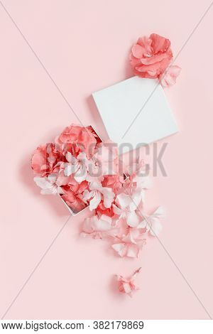 Gift Box Full Of Flowers  Over A Pink Background  Top View