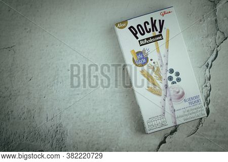 Samut Prakan, Thailand - August 24, 2020 : Glico Pocky Wholesome Blueberry Yogurt An Upgraded Pocky 