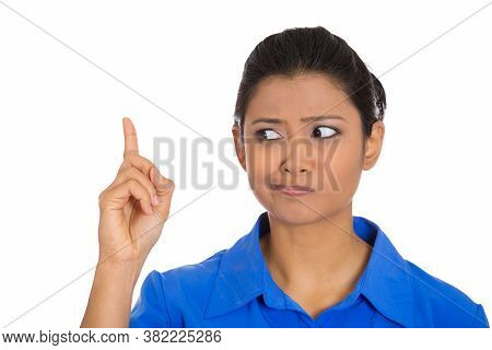 Portrait Of A Young Woman Thinking Daydreaming About Something With Inger Pointing Up Looking For An