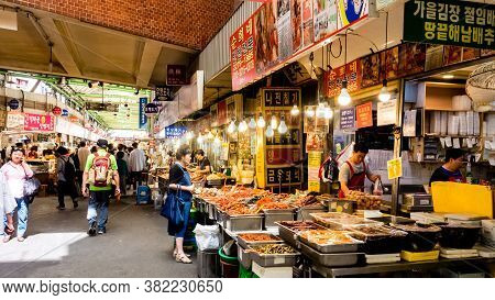 Seoul, South Korea - June 26, 2017: Woman Buys Food At Gwangjang Market In Seoul.