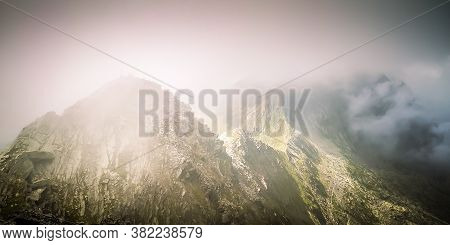 Misty Fagaras Mountains, Romania. Mist Over The Alps Of Transylvania.
