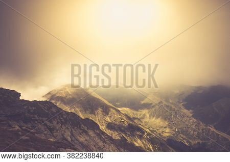 Misty Fagaras Mountains, Romania. Mist Over The Alps Of Transylvania.