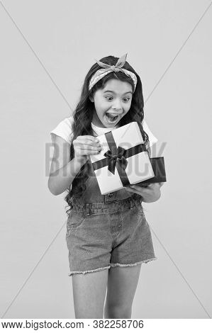 Surprised Kid On Yellow Background. Birthday Surprise For Her. Bargain Sale Concept. Black Friday Di