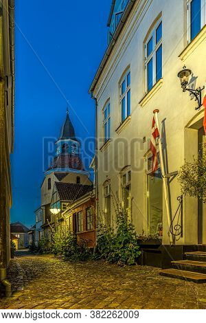The Danish Flag And The Bell-tower In A Narrow Alley  In Faaborg, Denmark, August 17, 2020