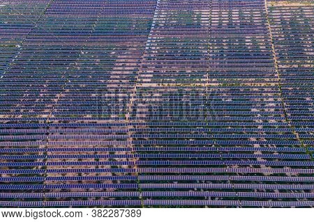 Aerial View Of The Solar Panel In Solar Farm For Green Energy