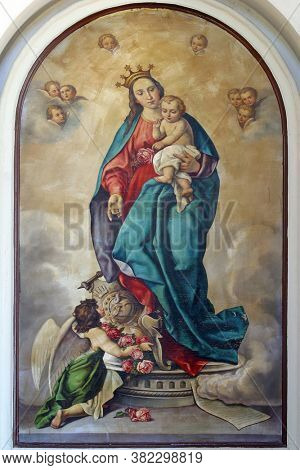 LUN, CROATIA - AUGUST 17, 2013: Virgin Mary with baby Jesus altarpiece at St. Jerome parish church in Lun, Croatia