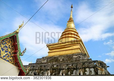 The Upper Part Of Wat Phra That Chang Kham Worawihan Temple's Viharn And Main Chedi In Nan Province,