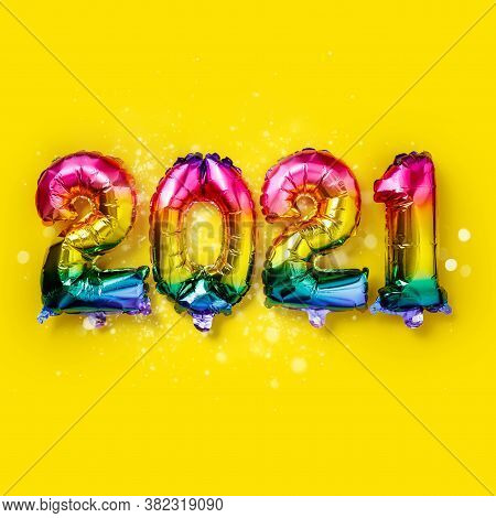 Rainbow Colored Foil Balloons In The Form Of Numbers 2021. New Year Celebration