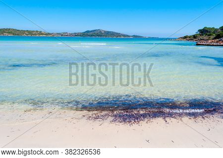 Clear Water And White Sand In Lu Impostu Beach, Costa Smeralda. Sardinia, Italy