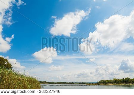 Calik Lagoon Under A Cloudy Sky In The Summertime. Sardinia, Italy