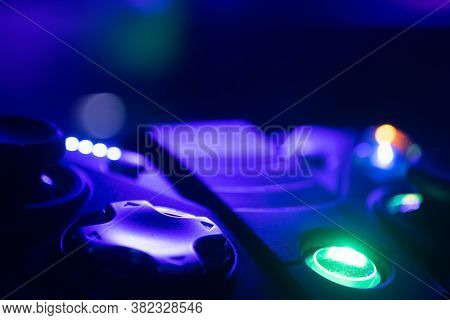 Extreme Close Up Of A Game Controller Directional Pad With Rgb Lighting