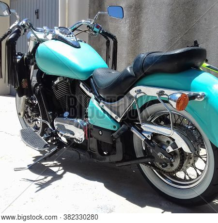Sardinia, Ita - June 16, 2019: Turquoise Kawasaki Vn 800 Classic With White Wall Tires Parked By A G
