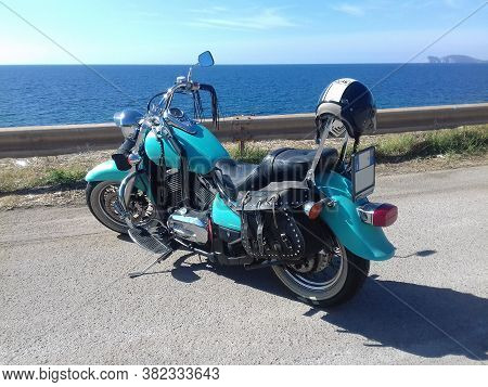 Sardinia, Ita - November 14, 2020: Turquoise Kawasaki Vn 800 Parked By The Sea On A Sunny Day