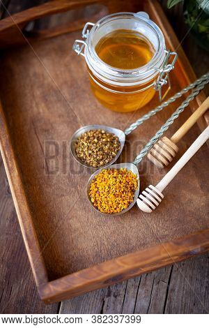 Bee Pollen Granules. Fresh Oney On Wooden Table. Still Life Bee Product Background. Wooden Spoon Wit