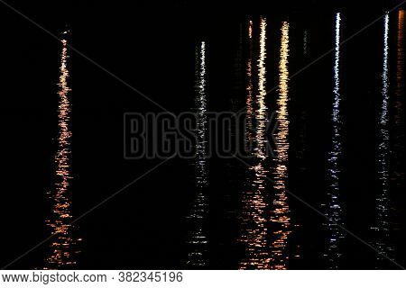 Light Reflections On A River At Night