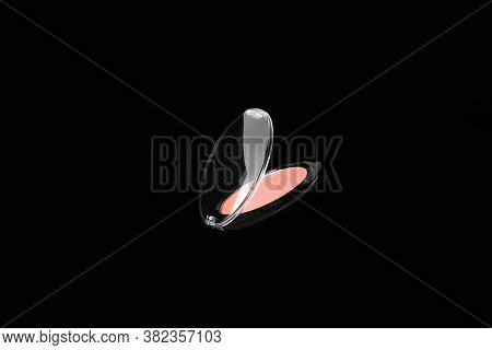 Flying Makeup Professional Product For Face On Black Background. Creative Composition With Pink Eyes