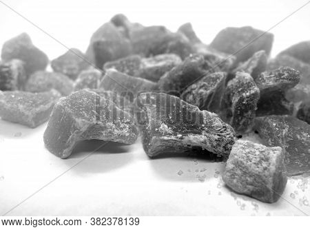 Succade From Ginger On White In Black And White. Food And Ingredients Background.