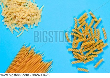 Pasta Concent. Differernt Types Of Pasta On Blue Background. Creative Layout Pasta Guide Concept. Pa