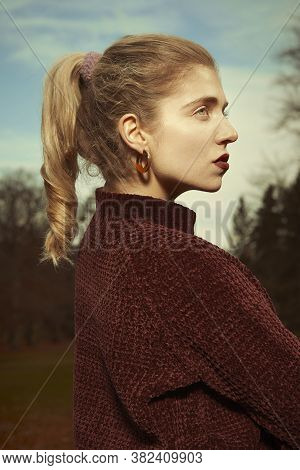 Nice Lady Posing In Autumn Park For Winter Portrait