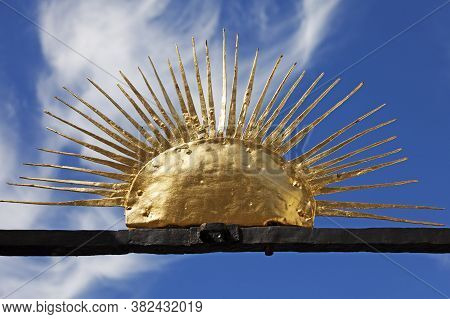 Skelleftea Norrland Sweden - August 8, 2020: A Sun Symbol Up On The Gate Of A Church