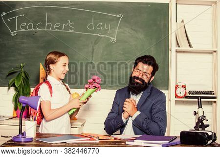 Back To School. Happy Teachers Day. Small School Girl Kid With Flower Bouquet. Teachers Day. Daugght