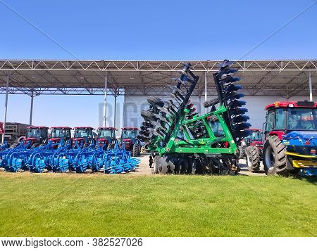 Kyiv, Ukraine - June 16, 2020: Tractor And Unia Cultivator On The Land For Minimum-tillage Technolog