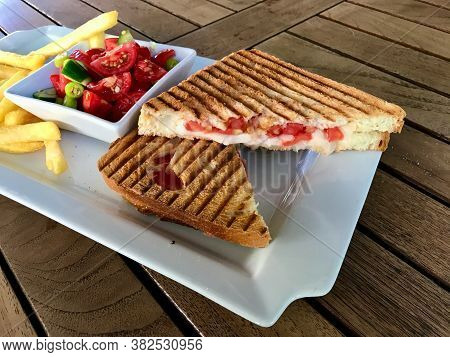 Turkish Fast Food Menu Toast With Salad And Potatoes / Club Sandwich Tost On Wooden Table.