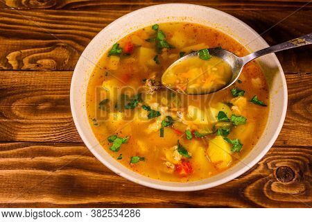 Georgian Traditional Food Soup Kharcho On Rustic Wooden Table. Top View