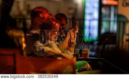 Odessa, Ukraine - Cirka 2020: Spectators At Concert In Theater Take Pictures Of Performance Of Their