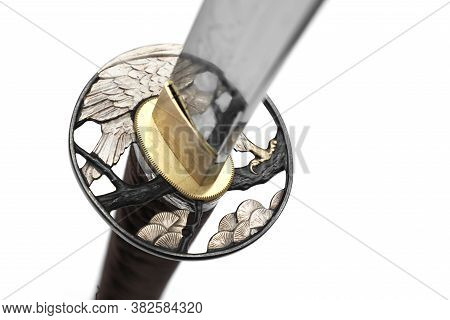 Tsuba : Hand Guard Of Japanese Sword Made Of Steel​  Isolated In White Background.  Selective Focus.