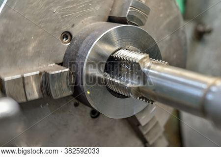 Tapping On A Lathe, The Tap Cuts The Hole By Applying Pressure From The Tailstock