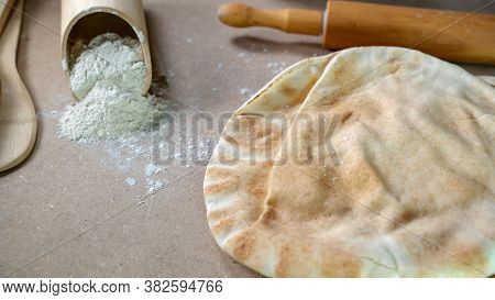 Kuboos Or Khubz - Arabic Bread On A Brown Table In The Kitchen Kitchen