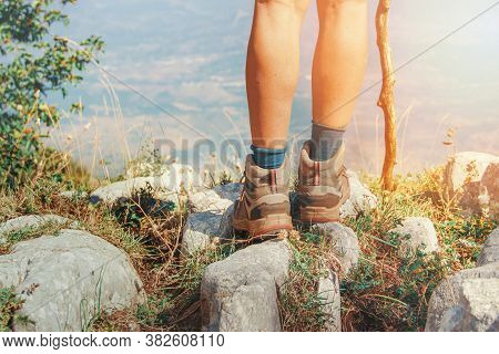 Close Up Of Women Legs Wearing Hiking Boots Stainding In Mountain - Travel And Outdoor Activities Co