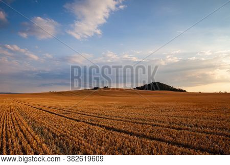 On The Empty Field After Harvesting In Summer Evening. Czech Republic. Amazing Sunset In Czech Bohem
