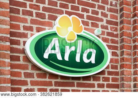 Aarhus, Denmark - June 5, 2019: Arla Foods Logo On A Brick Wall. Arla Foods Is An International Coop
