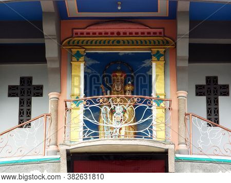 Medan, Sumatra, Indonesia, January 9, 2018: Image Of Virgin Mary With The Baby Jesus Between Two Cro