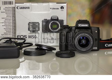 Frankfurt, Germany - 26th August 2020: A German Photographer Prepares His Old Canon Eos M50 With The