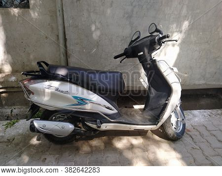 New Delhi, Delhi/india- June 11 2020: A Two Wheeler White Color Scooter Parked On The Parking.