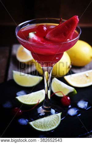 Watermelon Margarita With Lemon, Lime And Ice, Alcoholic Cocktail, Vintage Wooden Background, Select