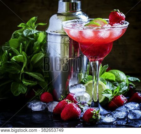 Alcoholic Cocktail With Strawberry, Lime And Ice, Black Background, Selective Focus