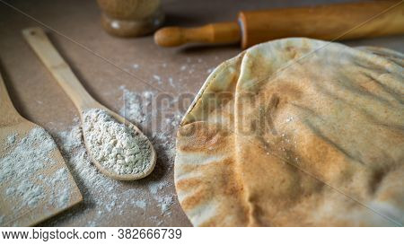 Kuboos Or Khubz - Arabic Bread On A Brown Table In The Kitchen Kitchen
