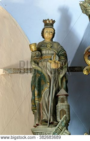 PETROVINA, CROATIA - JULY 22, 2013: Saint Barbara, statue on the altar of Saint Anthony the Hermit in the parish church of Saint Peter in Petrovina, Croatia