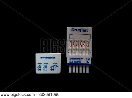 Urine Drug Test Isolated On Black Background. Doping Or Drug Addiction Concept.